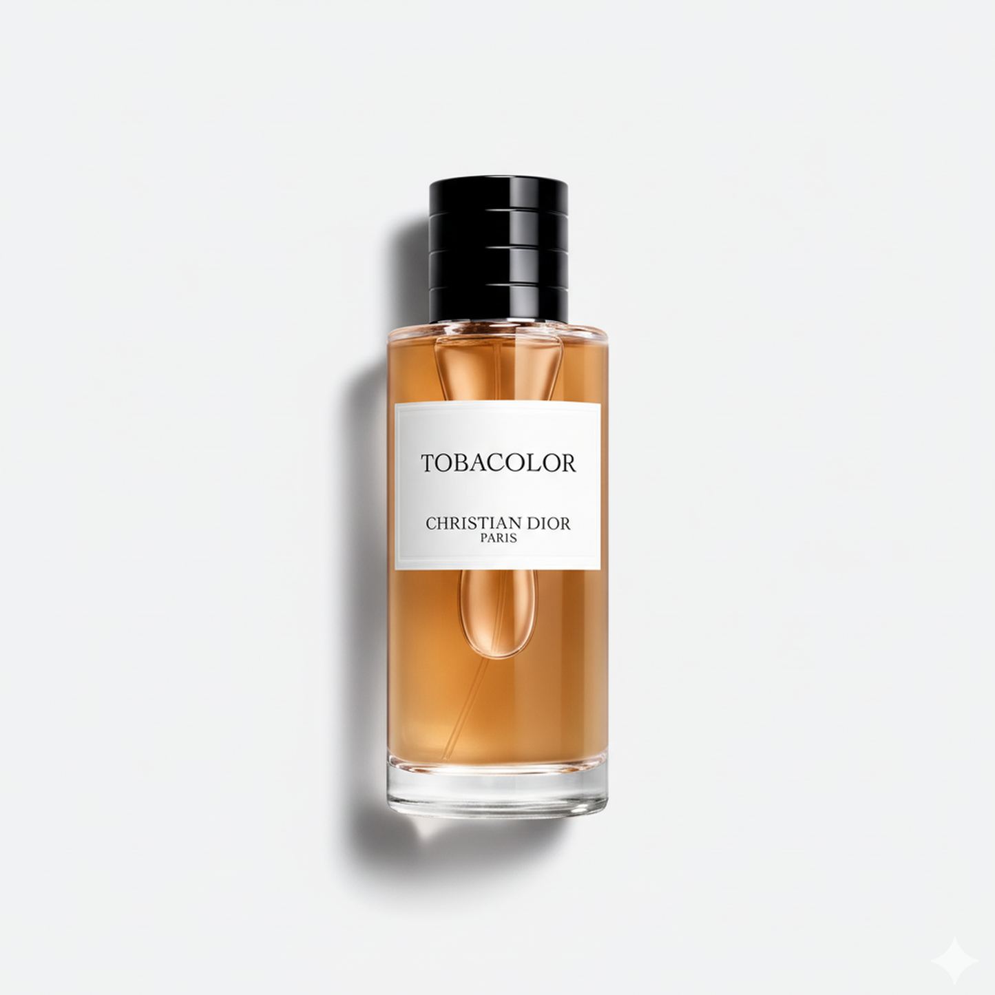 Bottle of Dior Tobacolor EDP fragrance on a white background with soft shadow