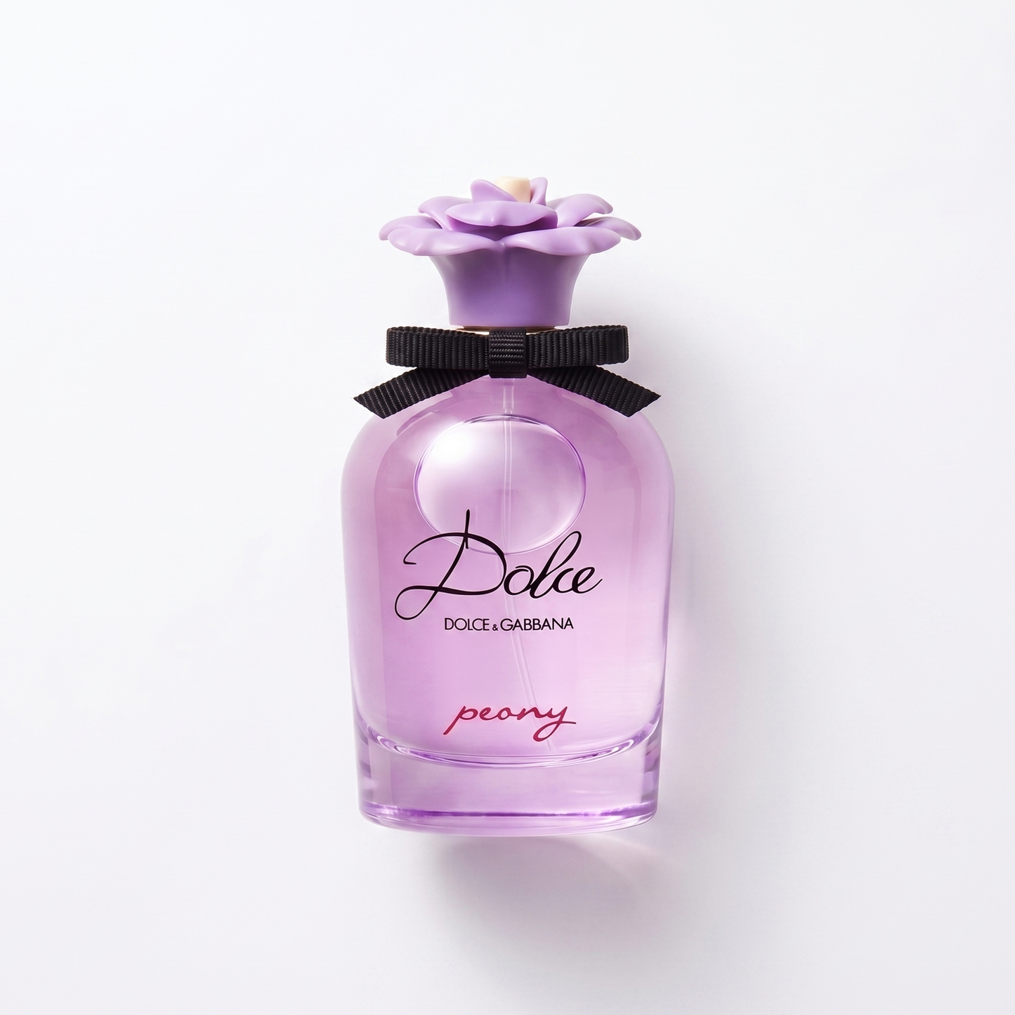 Bottle of Dolce Peony EDP fragrance on a white background with soft shadow