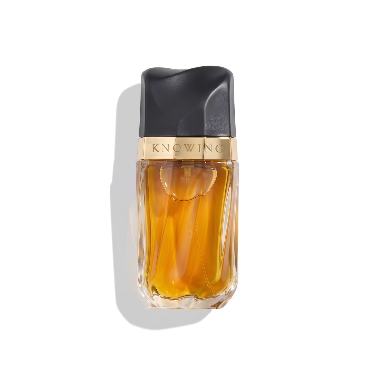 Bottle of Estée Lauder Knowing EDP fragrance on a white background with soft shadow