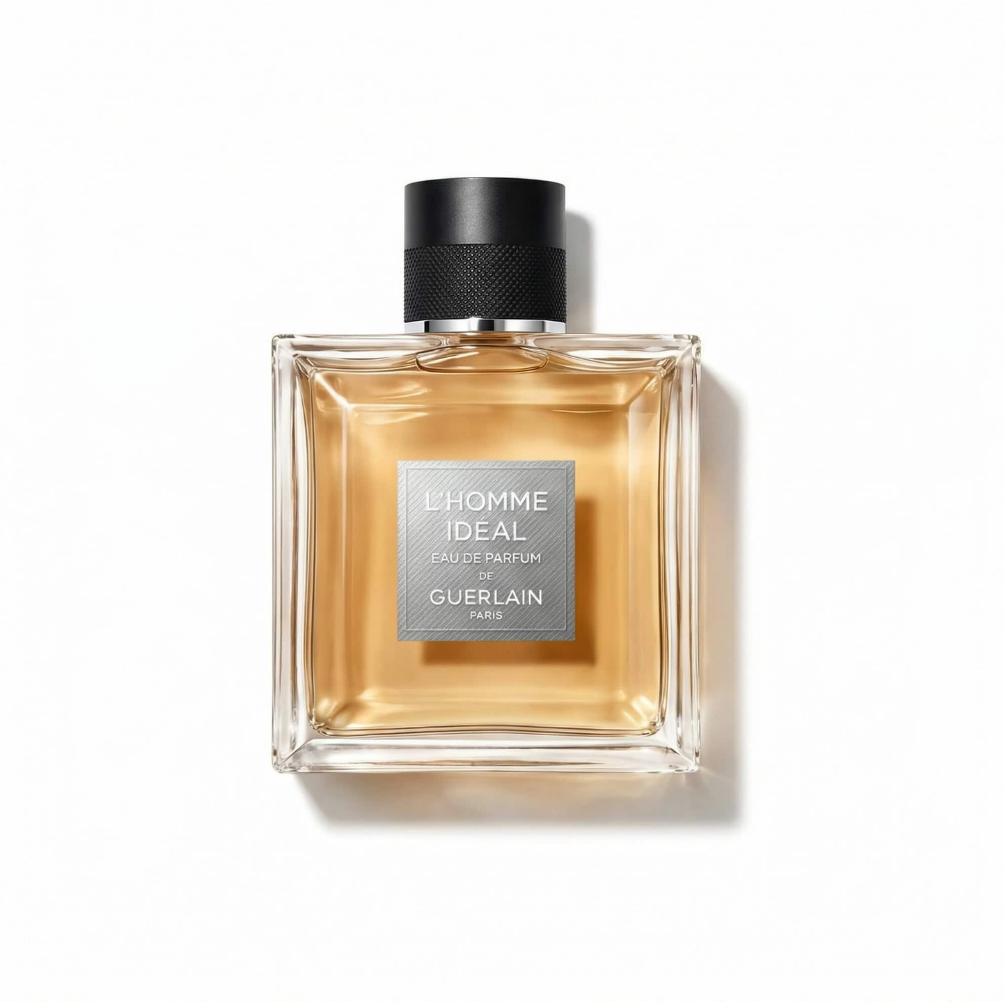 Bottle of Guerlain L’Homme Ideal EDP fragrance on a white background with soft shadow