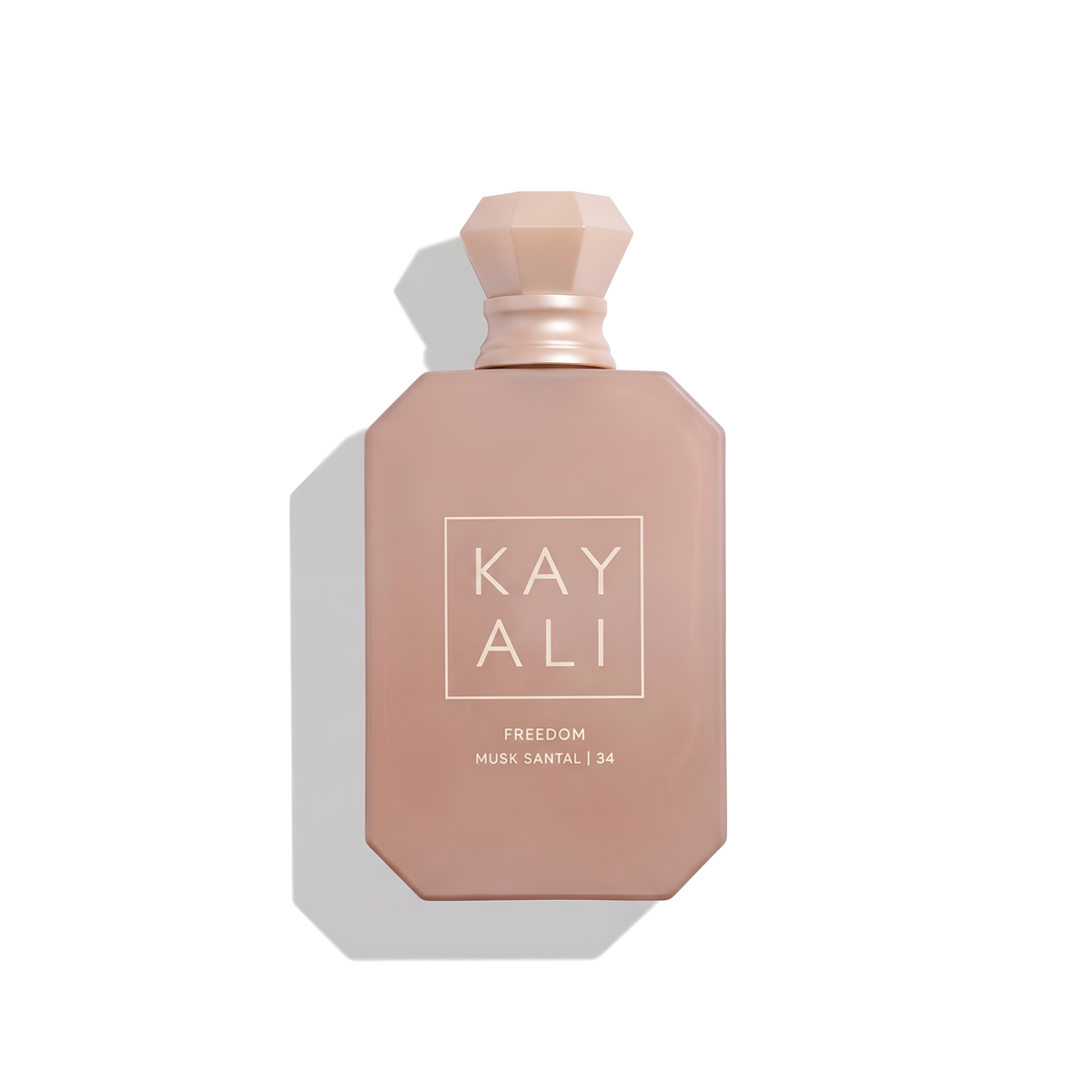 Bottle of Kayali Freedom Musk Santal | 34 EDP fragrance on a white background with soft shadow