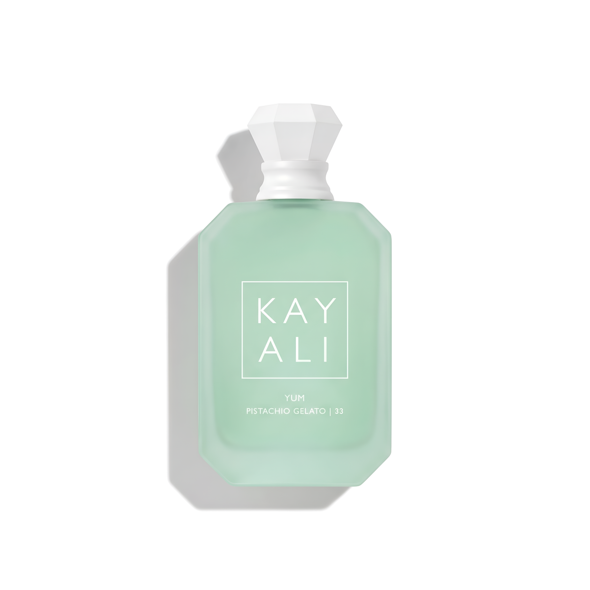 Bottle of Kayali Yum Pistachio Gelato | 33 EDP fragrance on a white background with soft shadow