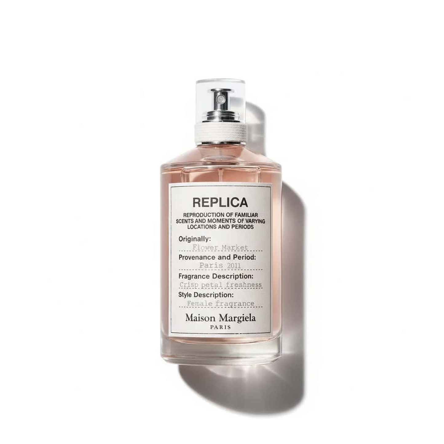 Bottle of Maison Martin Margiela Flower Market EDT fragrance on a white background with soft shadow