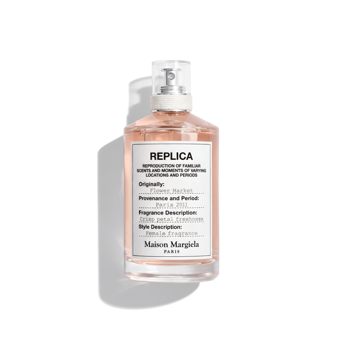 Bottle of Margiela Flower Market EDT fragrance on a white background with soft shadow