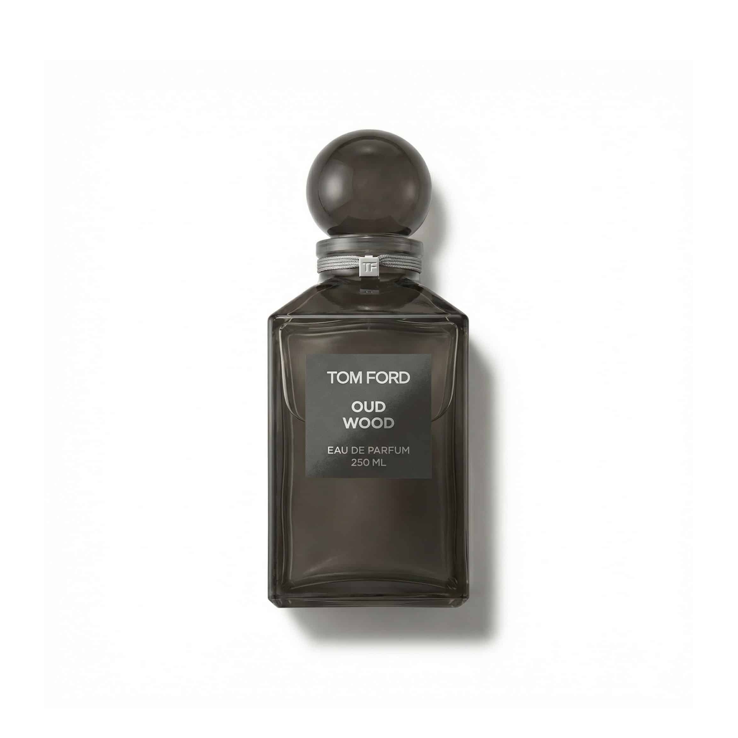 Bottle of Tom Ford Oud Wood EDP fragrance on a white background with soft shadow