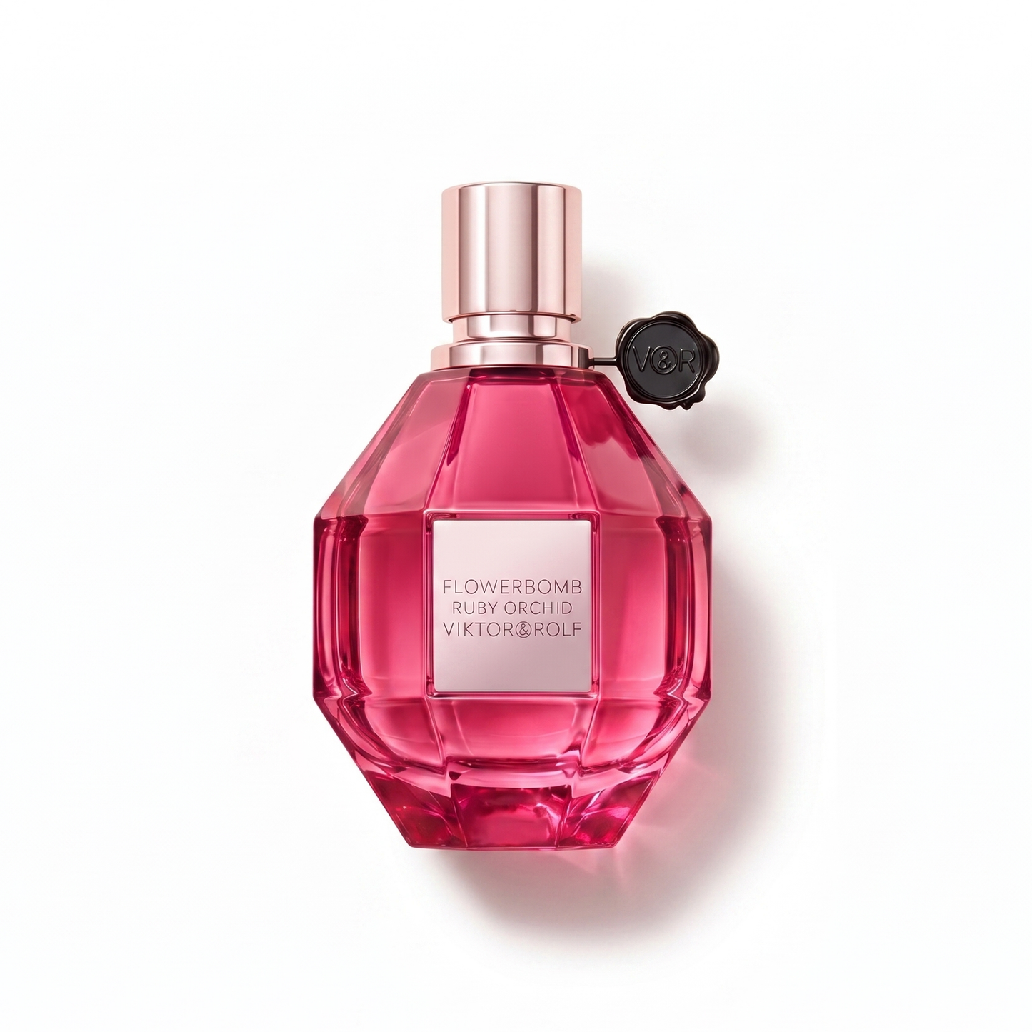 Bottle of Viktor & Rolf Flowerbomb Ruby Orchid EDP fragrance on a white background with soft shadow