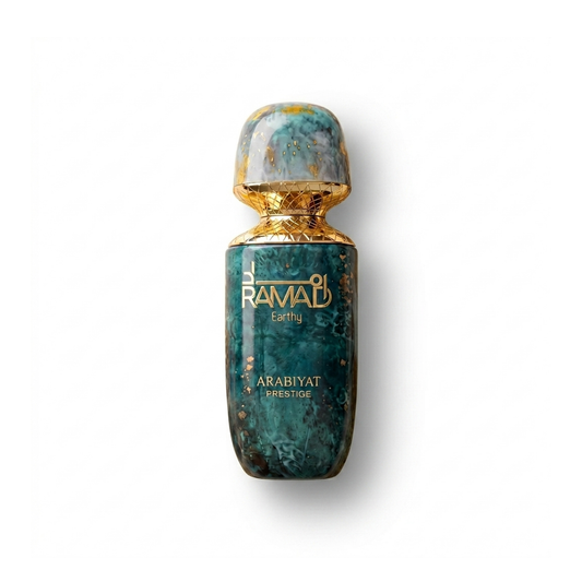 Bottle of Arabiyat Ramad Earthy Extrait fragrance on a white background with soft shadow