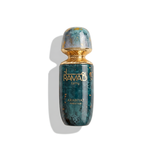 Bottle of Arabiyat Ramad Earthy Extrait fragrance on a white background with soft shadow