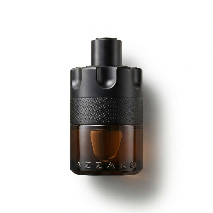 Bottle of Azzaro The Most Wanted Parfum fragrance on a white background with soft shadow