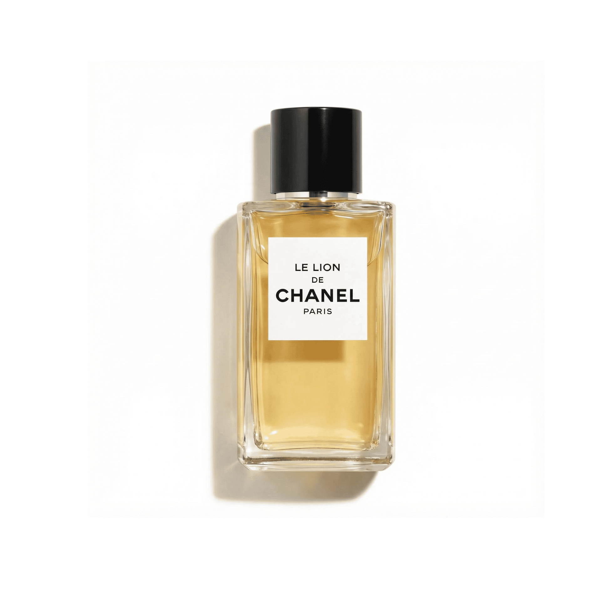 Bottle of Chanel Le Lion de Chanel EDP fragrance on a white background with soft shadow