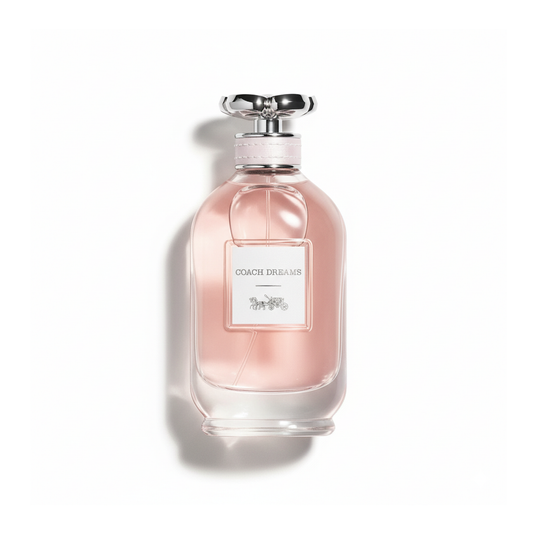 Bottle of Coach Dreams EDP fragrance on a white background with soft shadow