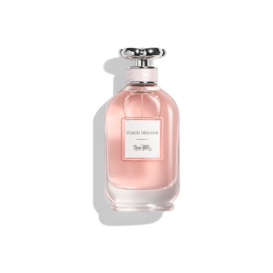 Bottle of Coach Dreams EDP fragrance on a white background with soft shadow