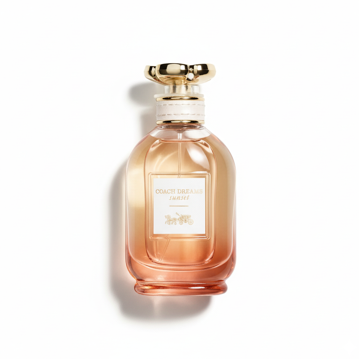 Bottle of Coach Dreams Sunset EDP fragrance on a white background with soft shadow