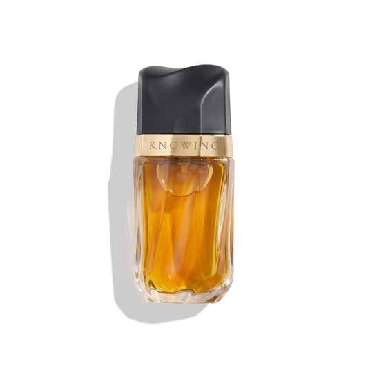 Bottle of Estée Lauder Knowing EDP fragrance on a white background with soft shadow