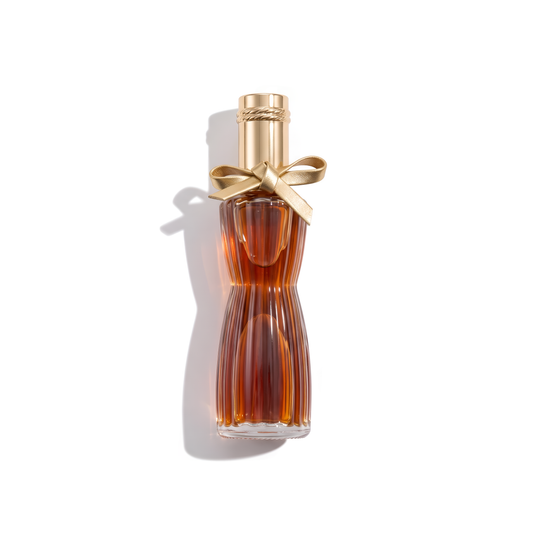 Bottle of Estée Lauder Youth Dew EDP fragrance on a white background with soft shadow