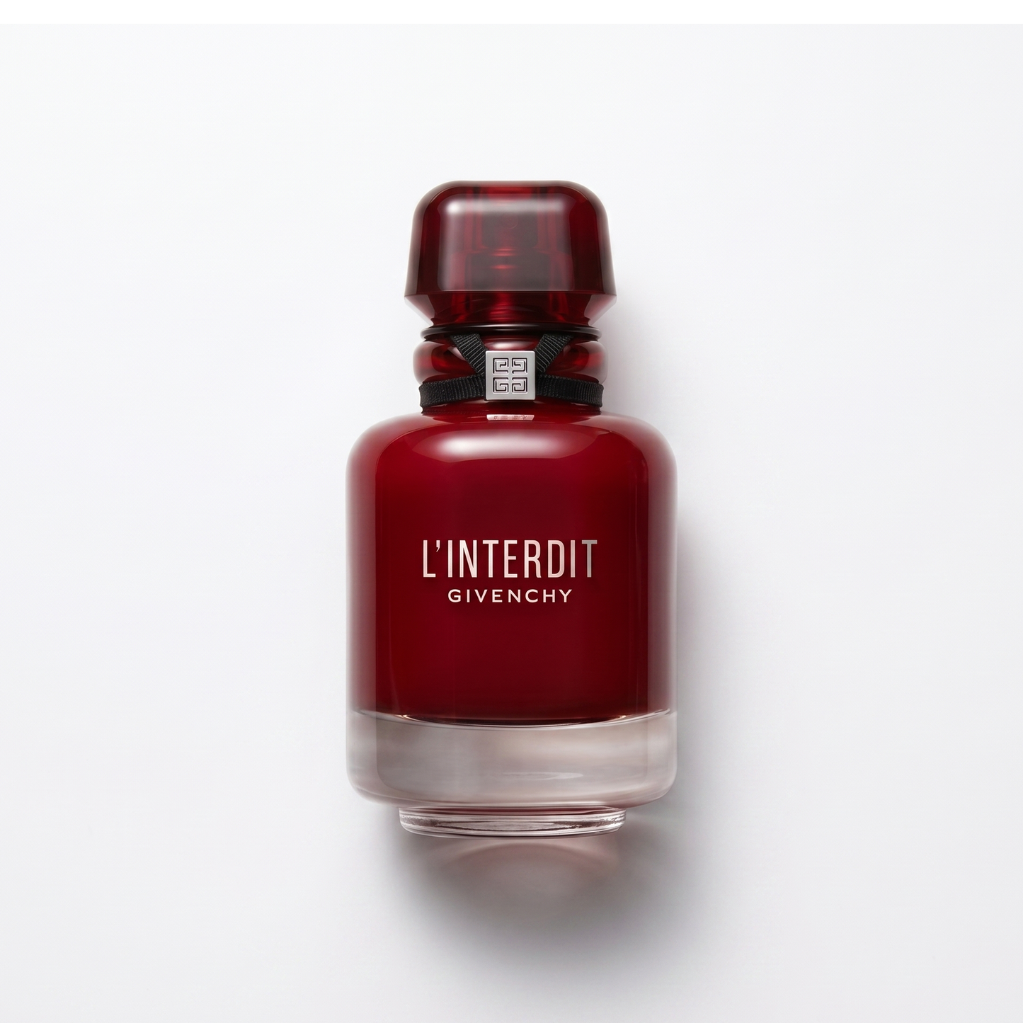 Bottle of Givenchy L'Interdit Rouge EDP fragrance on a white background with soft shadow