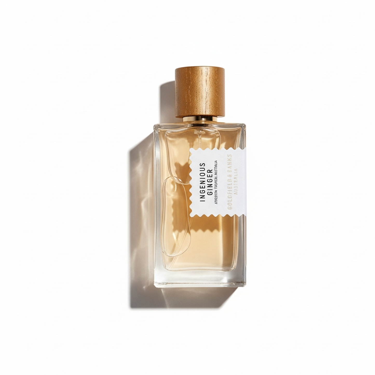 Bottle of Goldfield & Banks Ingenious Ginger EDP fragrance on a white background with soft shadow