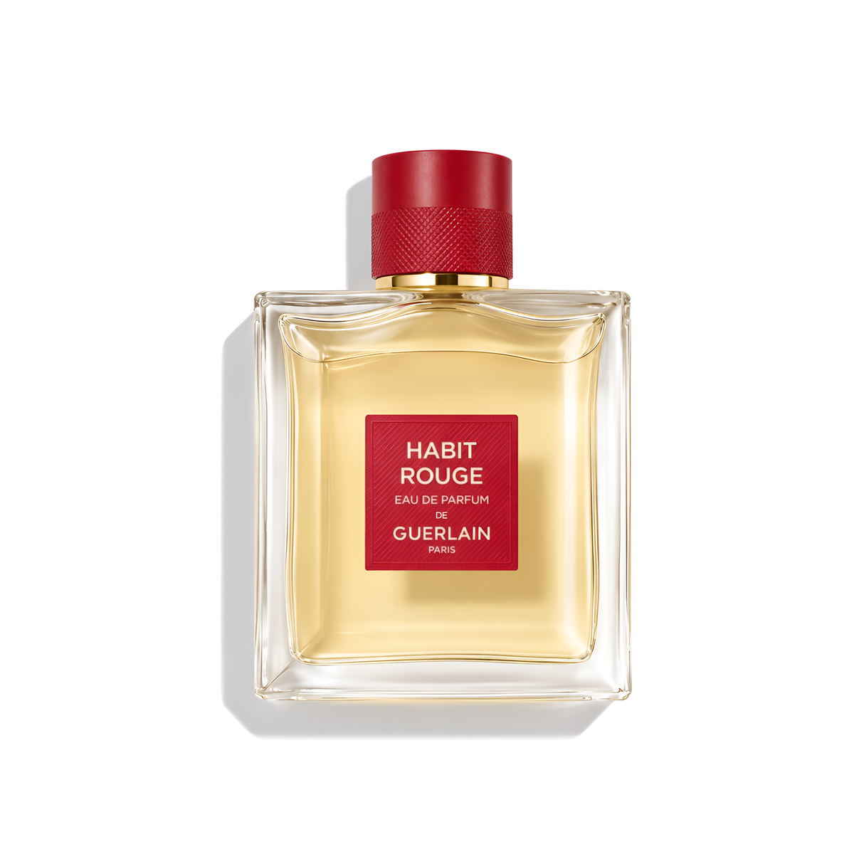 Bottle of Guerlain Habit Rouge EDP fragrance on a white background with soft shadow