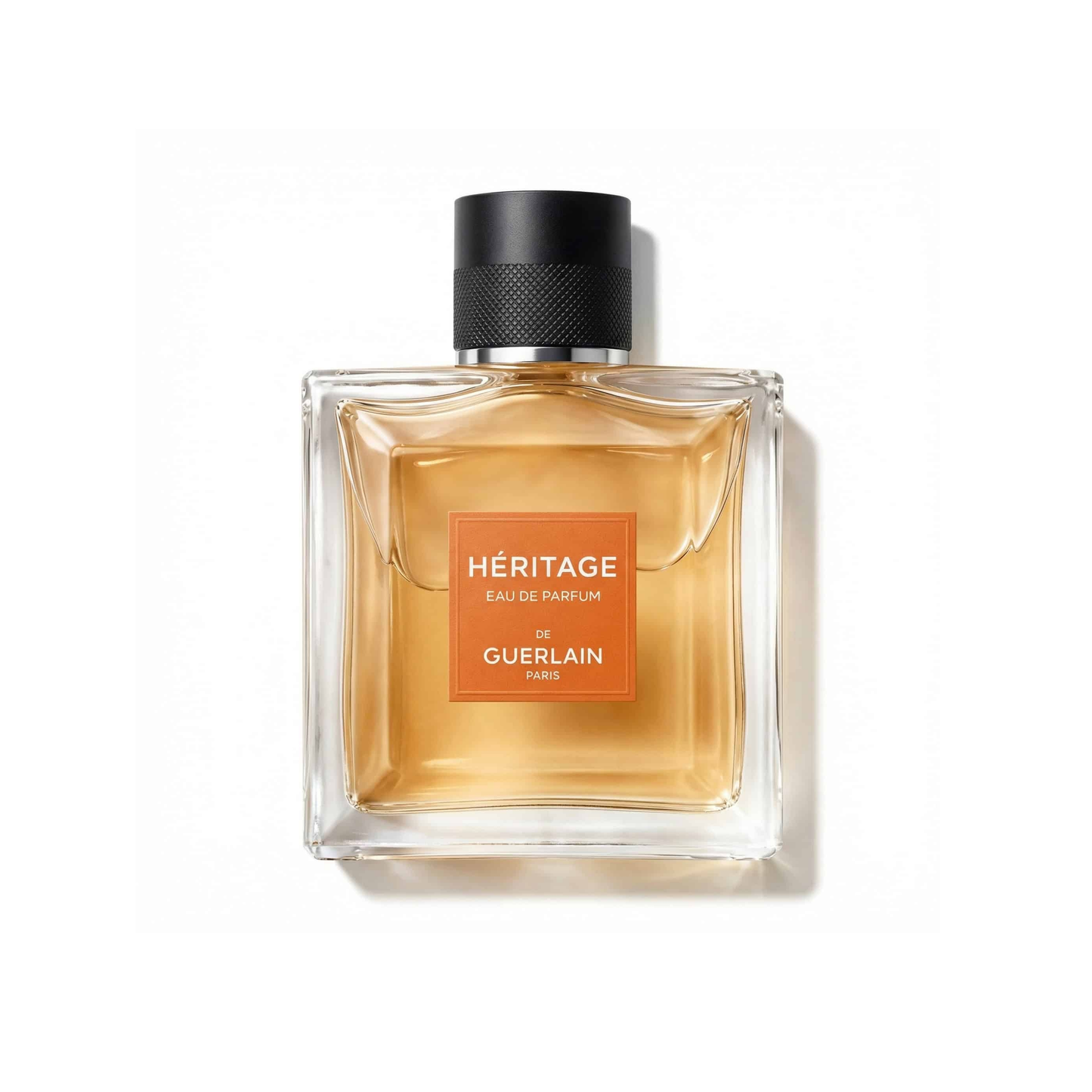 Bottle of Guerlain Heritage EDP fragrance on a white background with soft shadow
