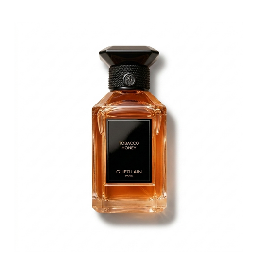 Bottle of Guerlain Tobacco Honey EDP fragrance on a white background with soft shadow