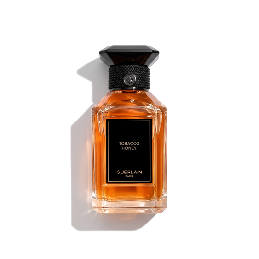 Bottle of Guerlain Tobacco Honey EDP fragrance on a white background with soft shadow