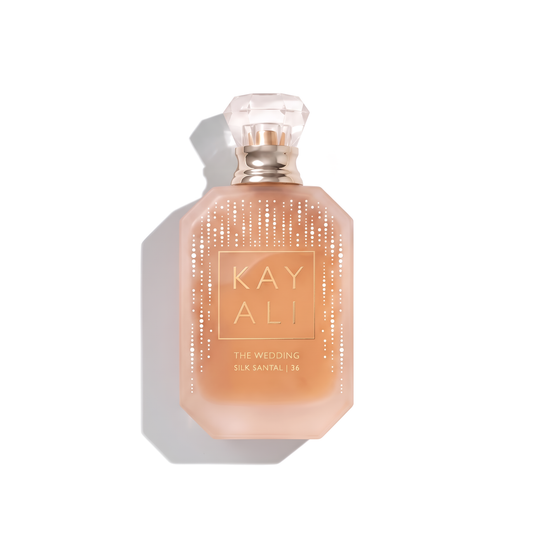Bottle of Kayali The Wedding Silk Santal | 36 EDP fragrance on a white background with soft shadow