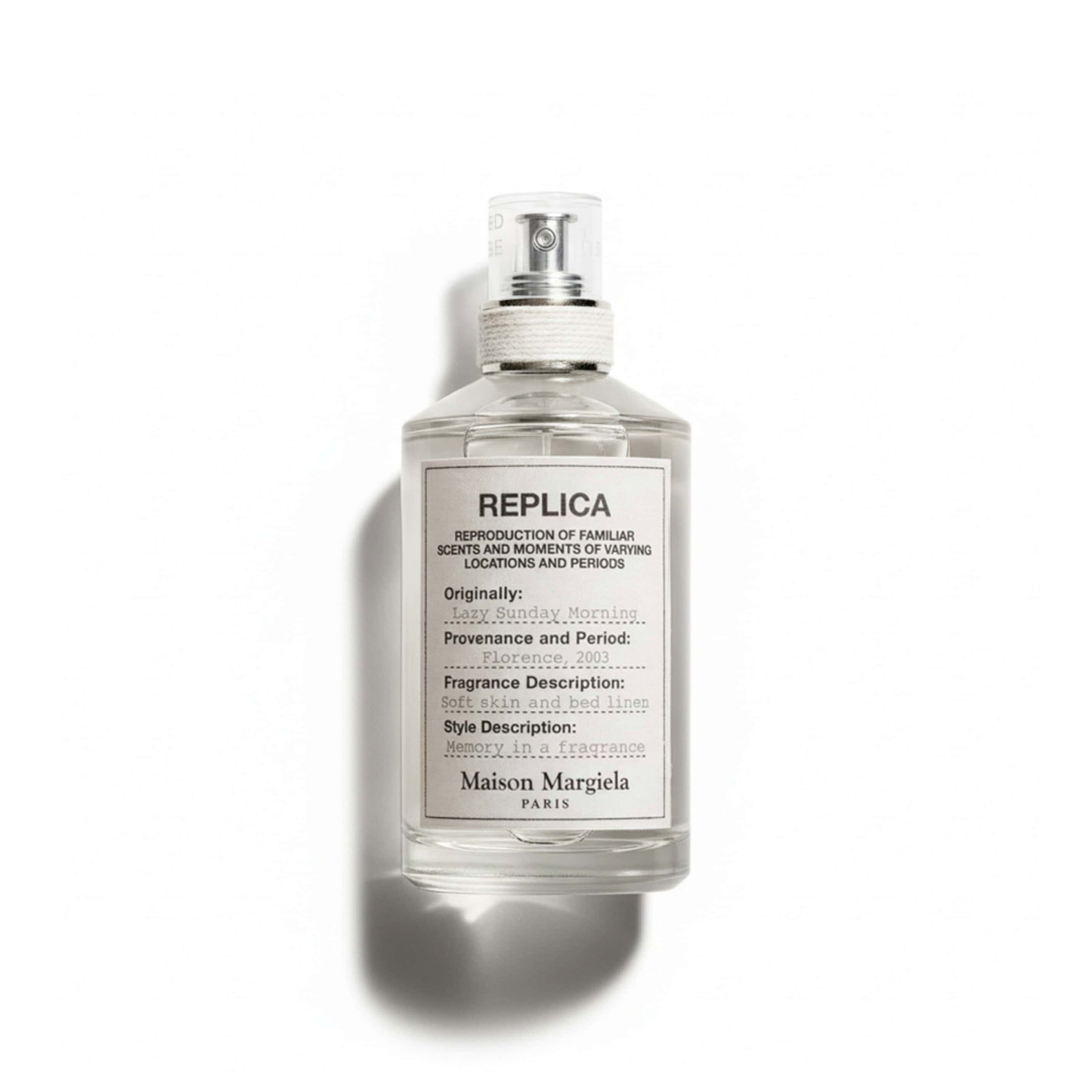 Bottle of Maison Martin Margiela Lazy Sunday Morning EDT fragrance on a white background with soft shadow