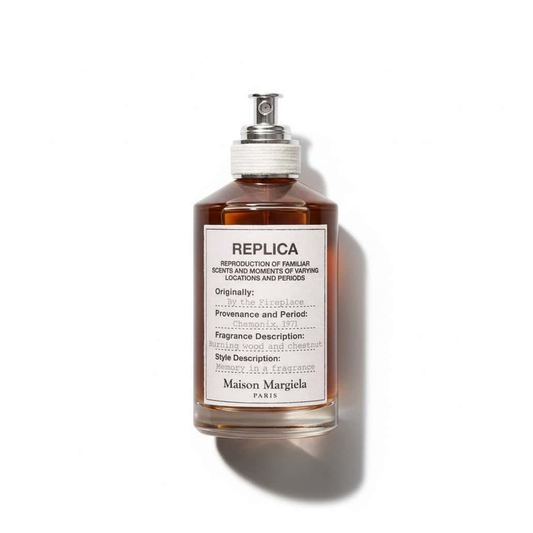 Bottle of Margiela By the Fireplace EDT fragrance on a white background with soft shadow