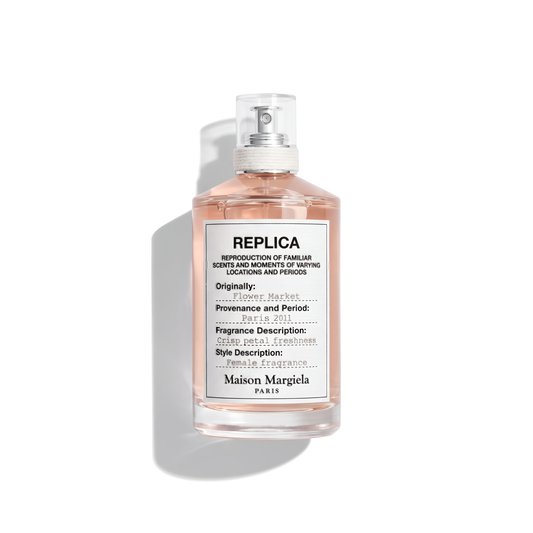 Bottle of Margiela Flower Market EDT fragrance on a white background with soft shadow