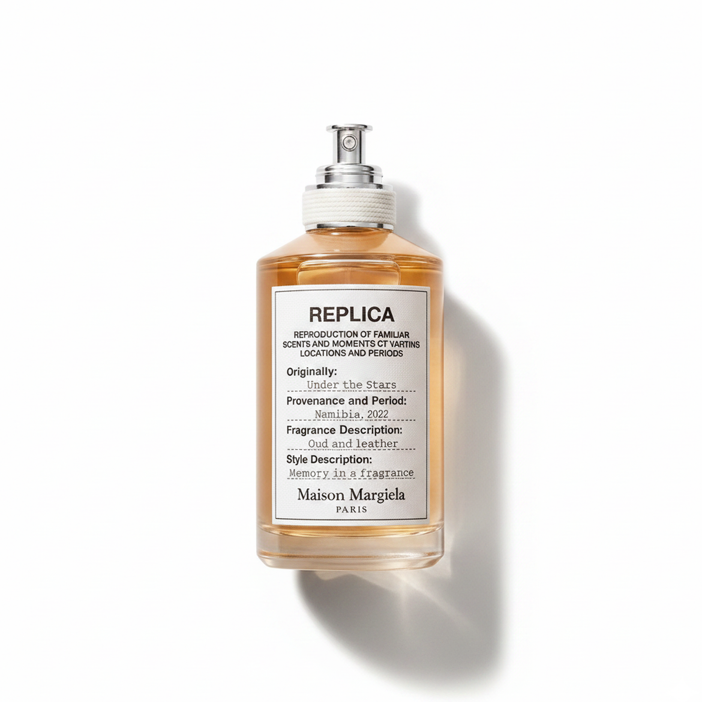 Bottle of Margiela Under The Stars EDT fragrance on a white background with soft shadow