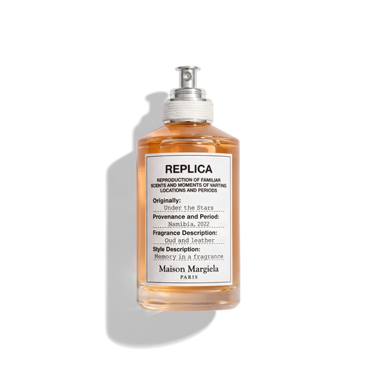 Bottle of Margiela Under The Stars EDT fragrance on a white background with soft shadow