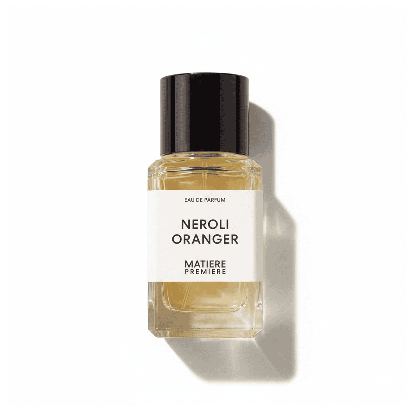 Bottle of Matiere Premiere Neroli Oranger EDP fragrance on a white background with soft shadow