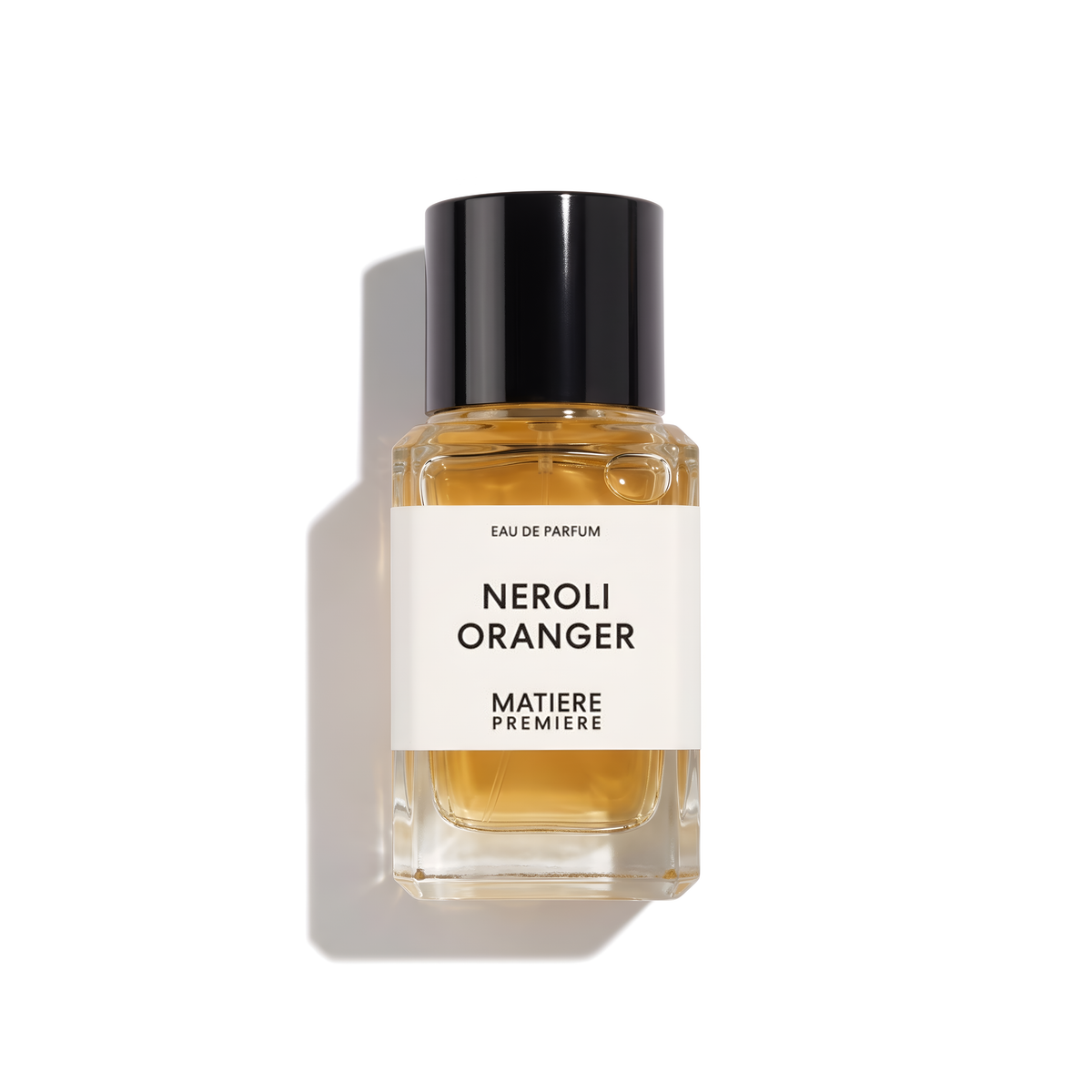 Bottle of Matiere Premiere Neroli Oranger EDP fragrance on a white background with soft shadow