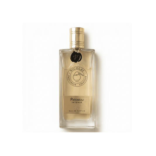Bottle of Nicolai Parfumeur Createur Patchouli Intense EDP fragrance on a white background with soft shadow