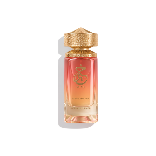 Bottle of Paris Corner Khair Peach Delulu EDP fragrance on a white background with soft shadow