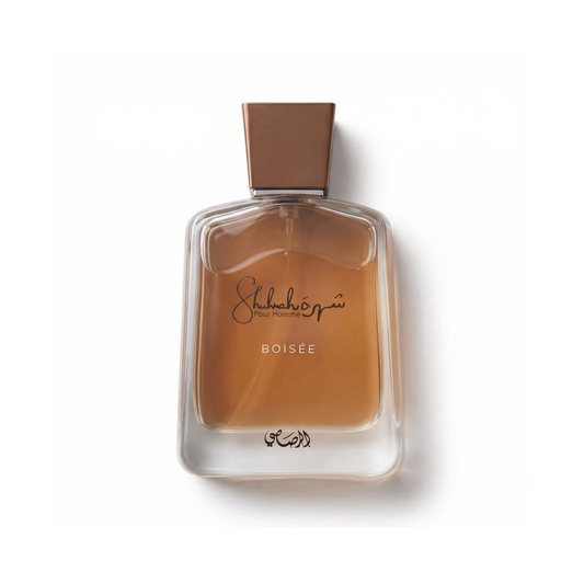 Bottle of Rasasi Shuhrah Boisee EDP fragrance on a white background with soft shadow