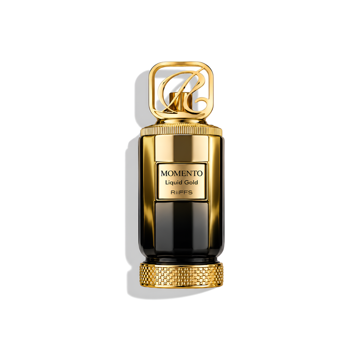 Bottle of Riffs Momento Liquid Gold Extrait fragrance on a white background with soft shadow