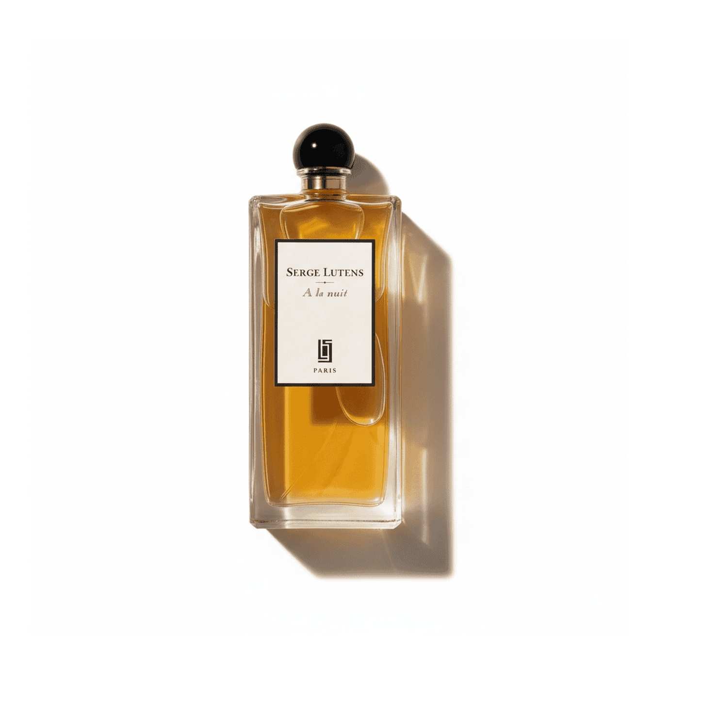 Bottle of Serge Lutens A La Nuit EDP fragrance on a white background with soft shadow