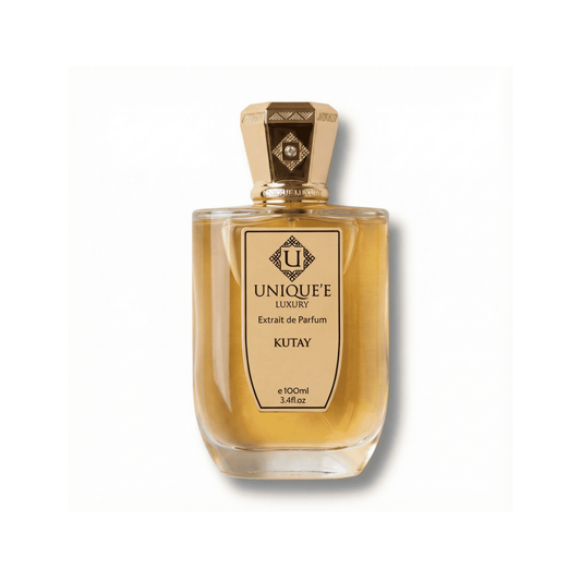Bottle of Unique'E Luxury Kutay Extrait fragrance on a white background with soft shadow