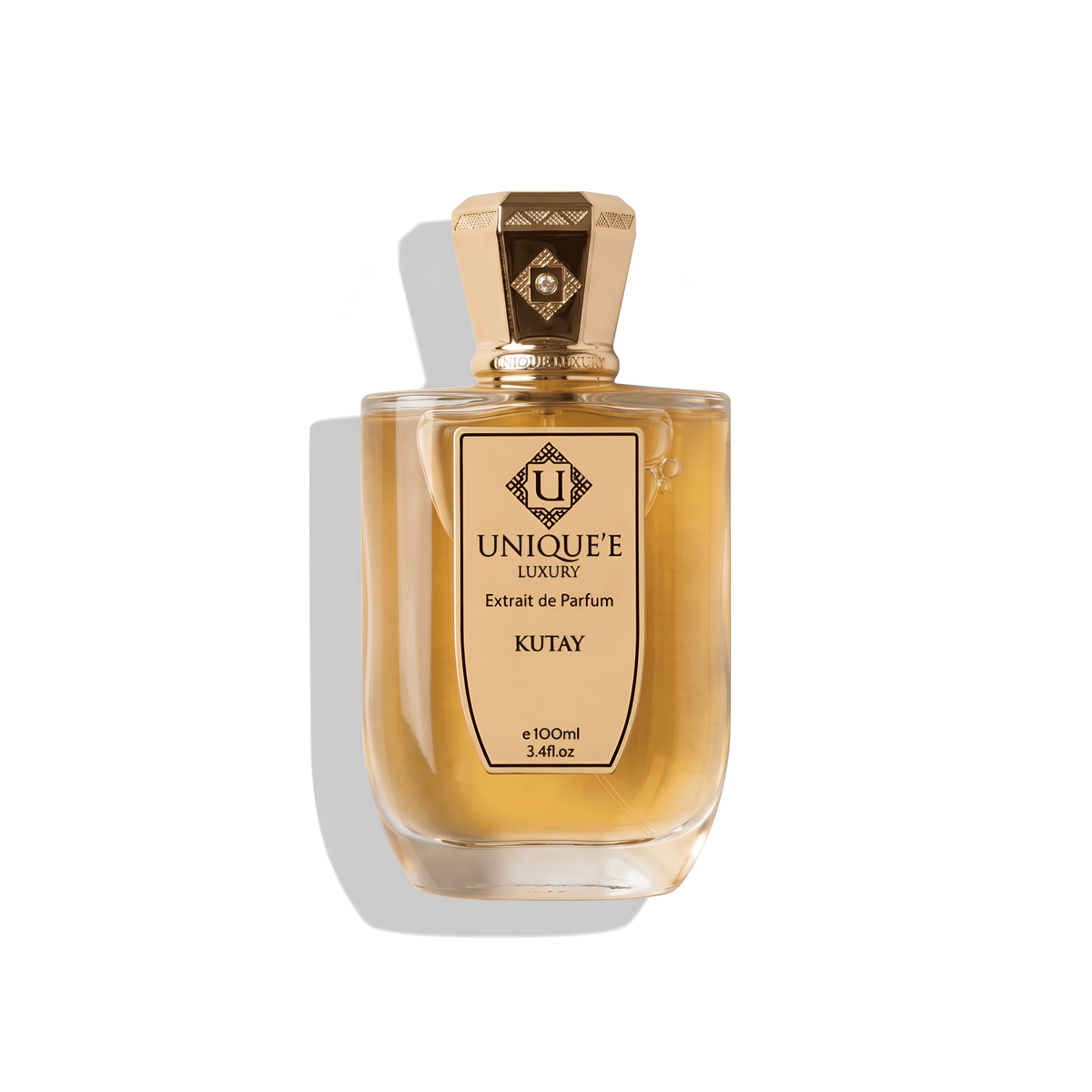 Bottle of Unique'E Luxury Kutay Extrait fragrance on a white background with soft shadow
