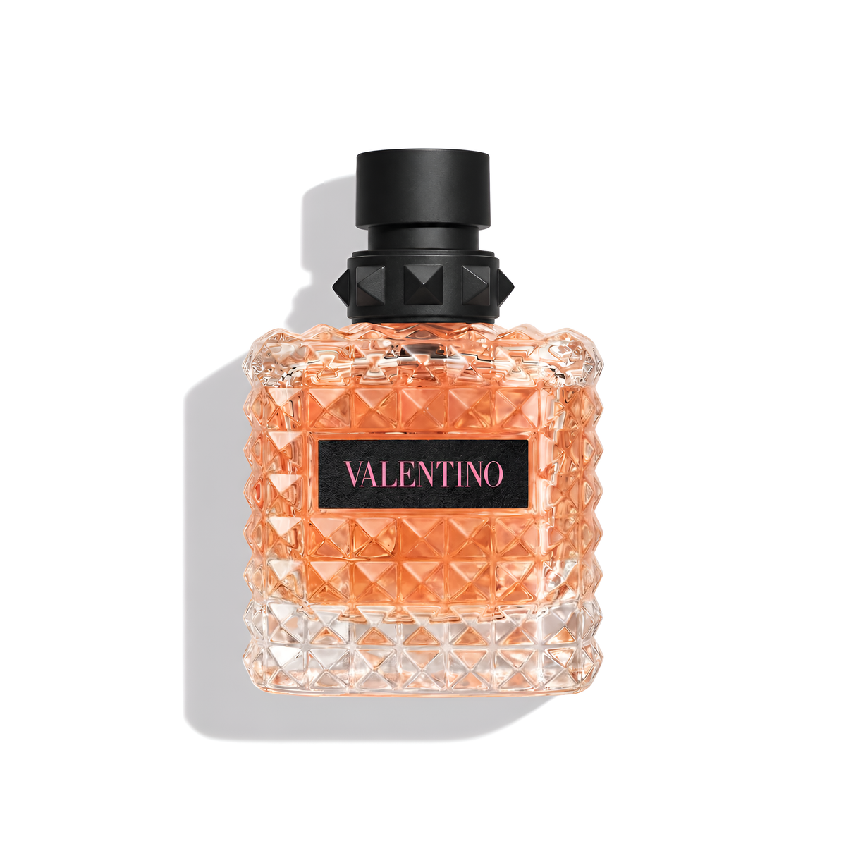 Bottle of Valentino Donna Born In Roma Coral Fantasy EDP fragrance on a white background with soft shadow
