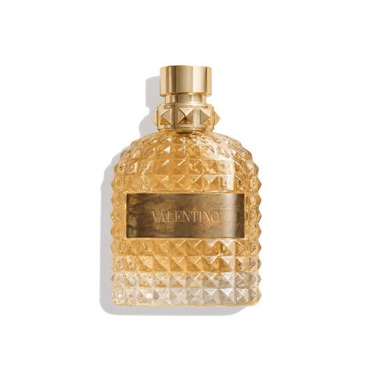 Bottle of Valentino Uomo Born in Roma The Gold EDT fragrance on a white background with soft shadow