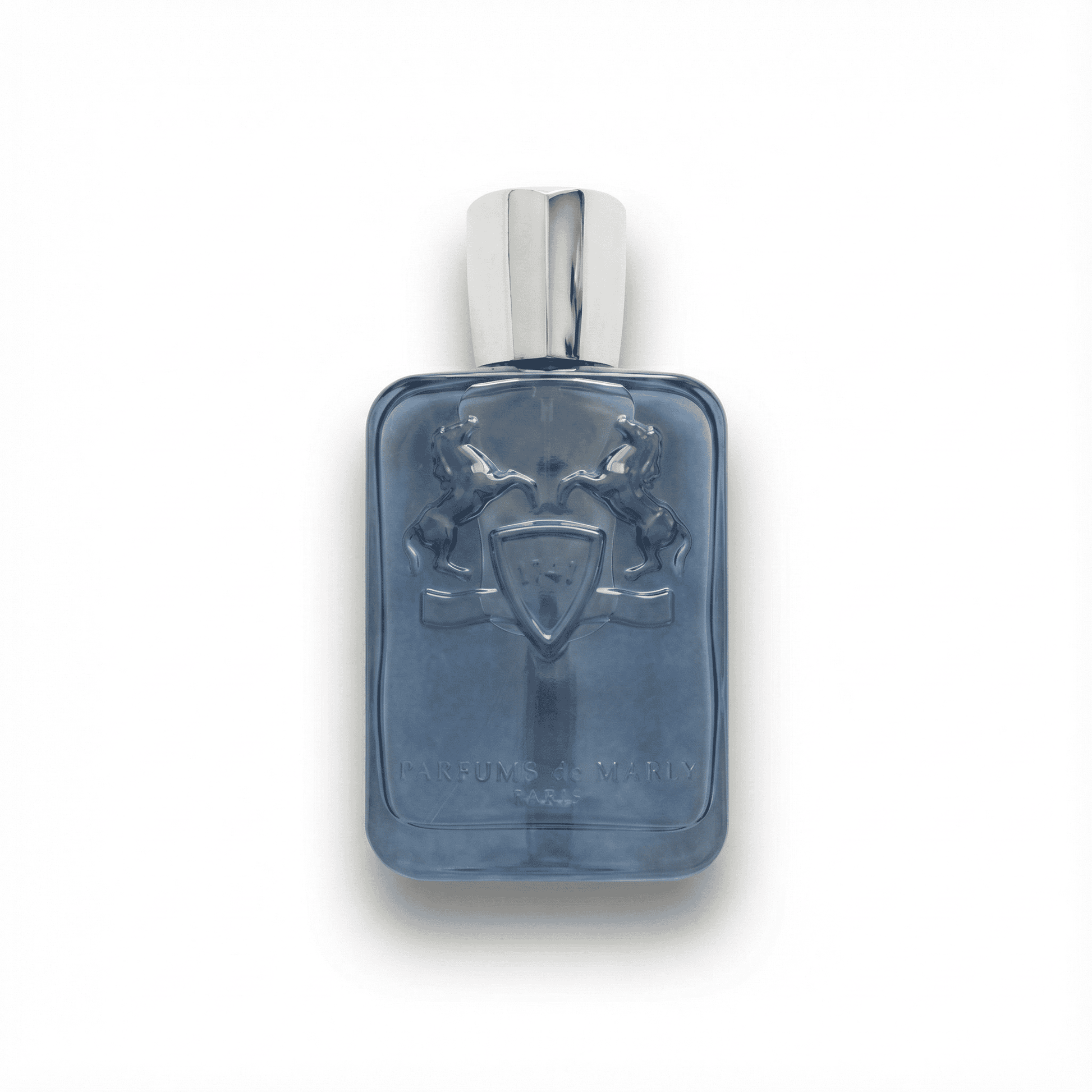 Luxurious men's perfume bottle with embossed heraldic design on a sleek blue glass surface.