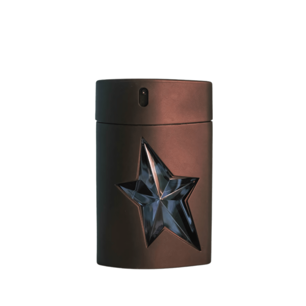 A 100ml bottle of Mugler A*Men Eau de Toilette with a bold black blue star-shaped design on a brown table.