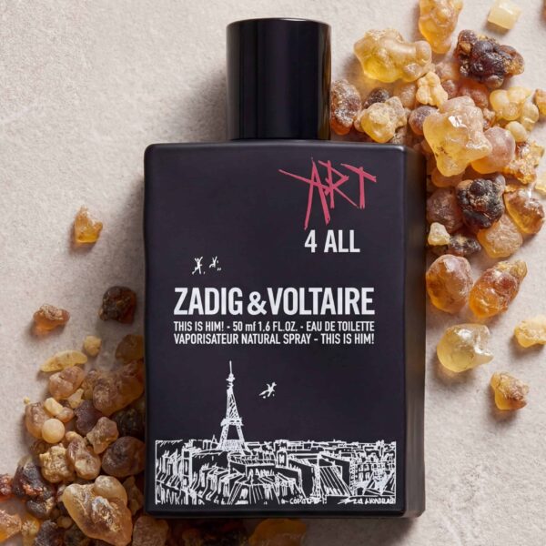 Vaporizer perfume bottle with Zadig & Voltaire "Art 4 All" fragrance surrounded by amber resin stones.