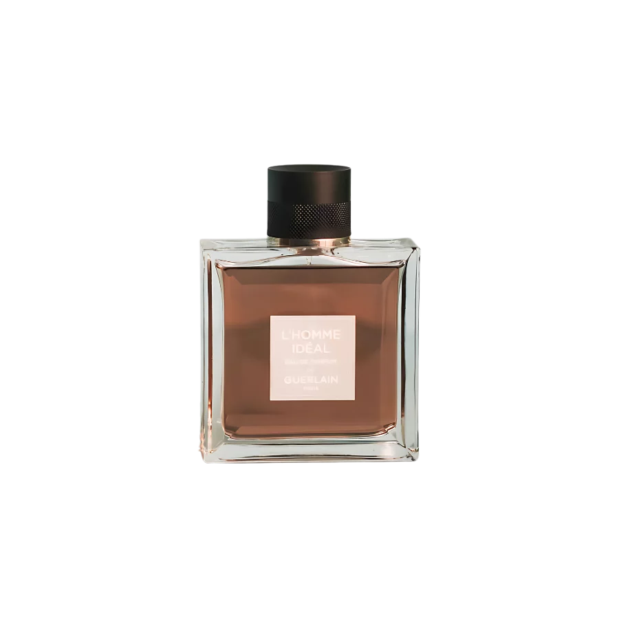 A 100ml bottle of Guerlain L’Homme Ideal Eau de Parfum, showcasing a square glass design with black cap, a beige label, placed on a brown table.