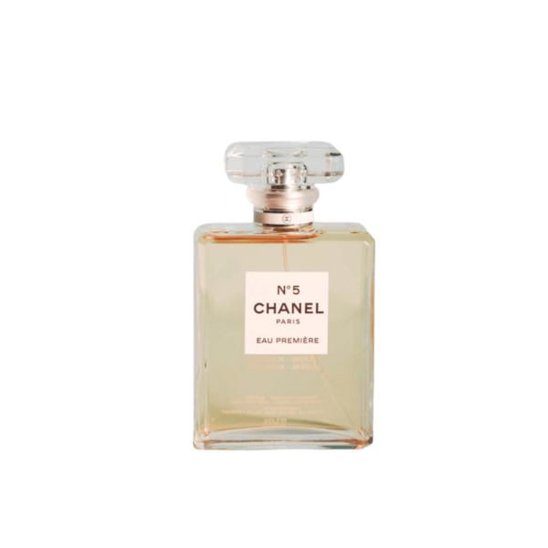 A 100ml bottle of Chanel No. 5 Eau Première Eau de Parfum with clear liquid and clear cap on a brown table.