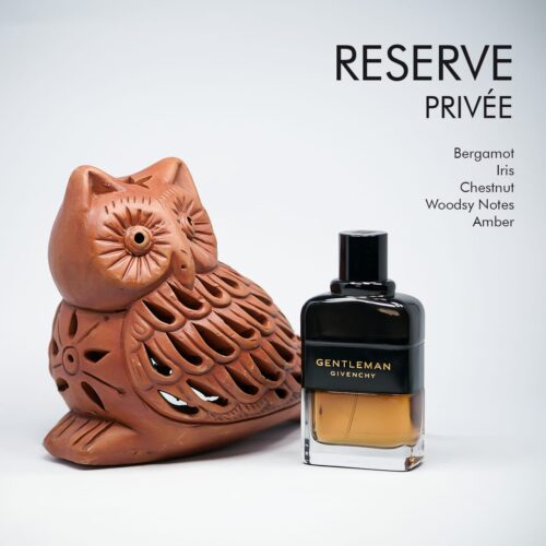 A 100ml bottle of Givenchy Gentleman Reserve Privee Eau de Parfum, showcasing a rectangular amber glass design with a black grey label and black cap, set on a brown table.