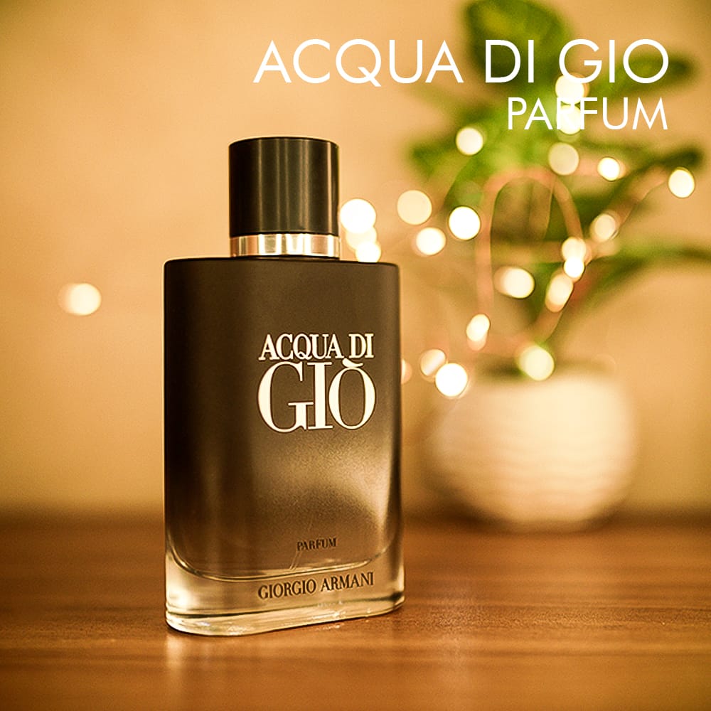 A 75ml bottle of Giorgio Armani Acqua Di Gio Parfum, featuring a black gradient transparent glass bottle with a black cap, on a brown table.