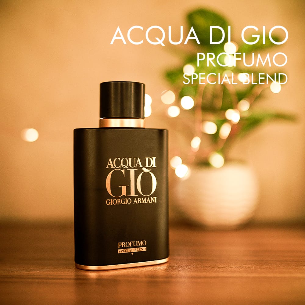 A 125ml bottle of Giorgio Armani Acqua Di Gio Profumo Special Blend Eau de Parfum with a black glass bottle and a gold-toned black cap, displayed on a brown table.